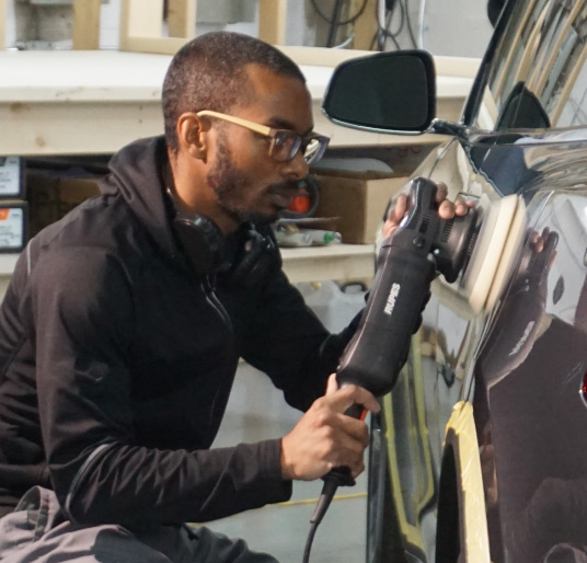 Fabian Evelyn Polishing a car