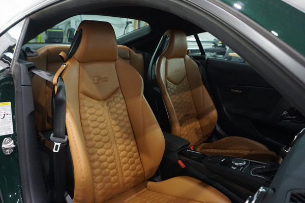 Sports car interior detailing with leather and trim restoration