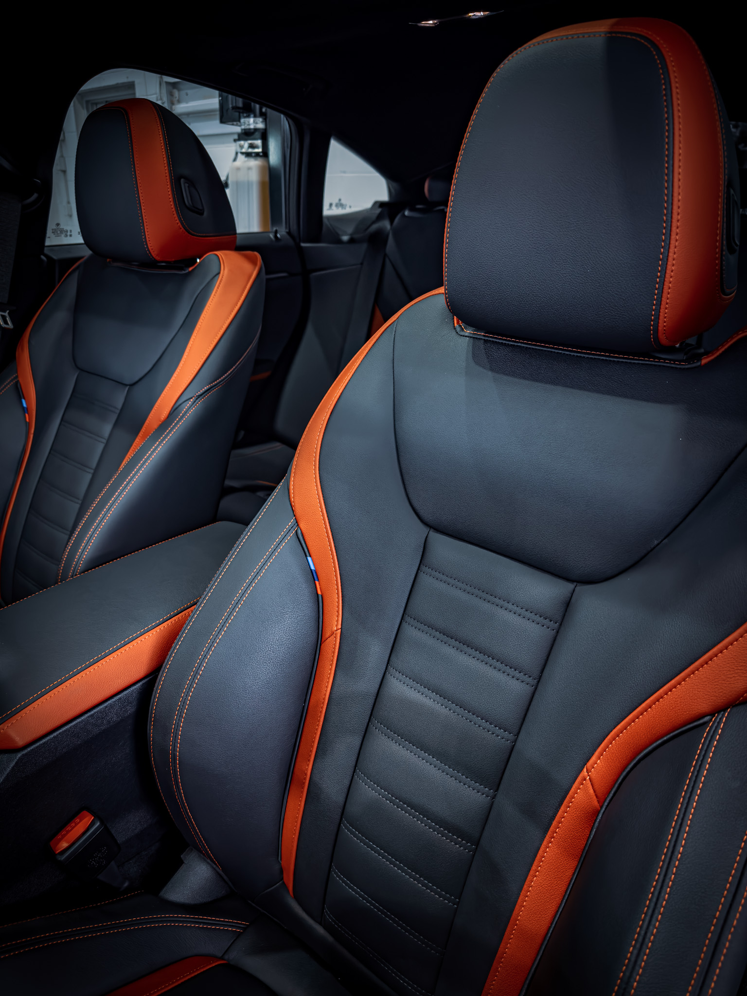 Detailed black vehicle interior with leather conditioning and trim work